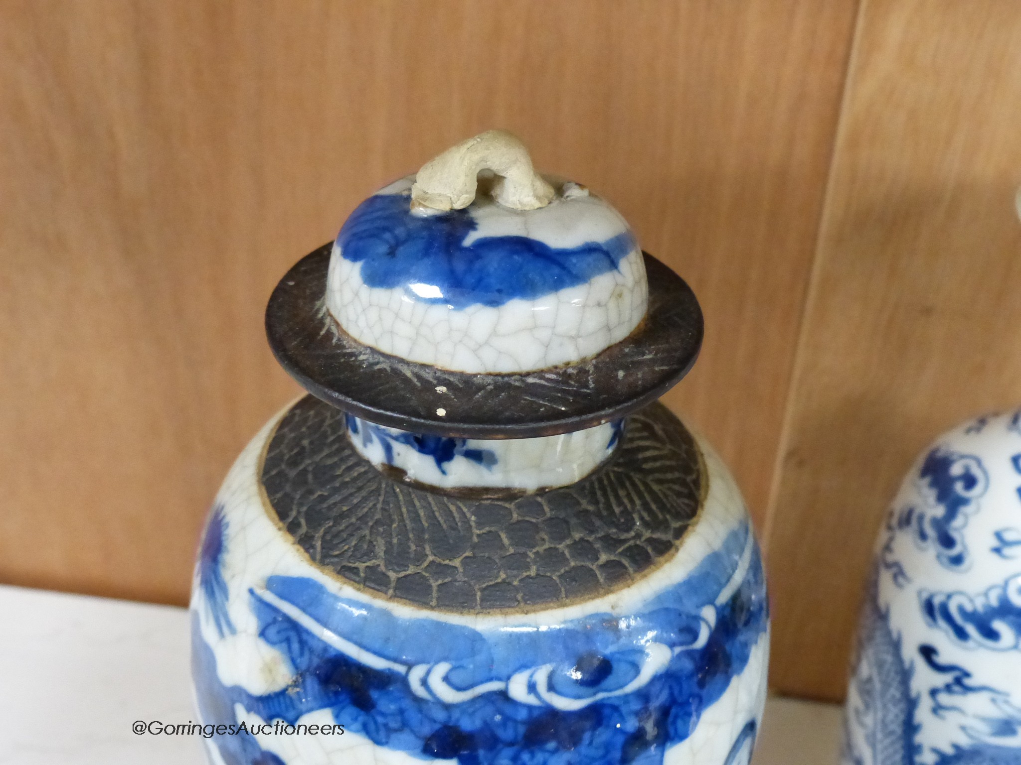 A collection of Chinese vases pottery figures and a compressed tea block, tallest piece 35cm